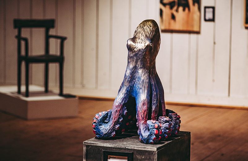 Carved from bass wood, this piece was painted over fifteen times and than scraped back to reveal the layers underneath.