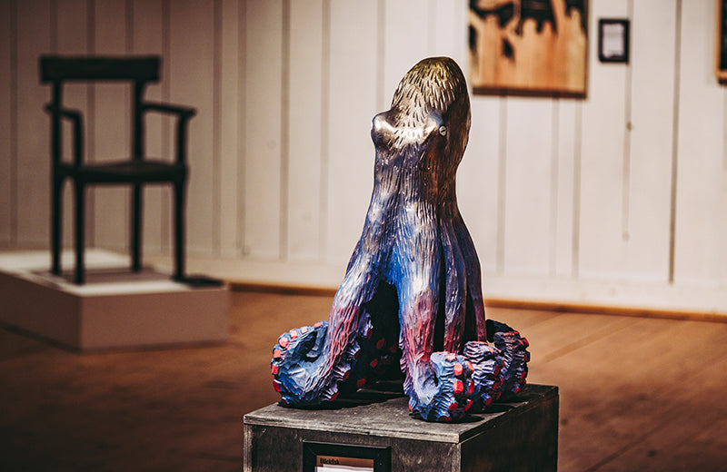 Carved from bass wood, this piece was painted over fifteen times and than scraped back to reveal the layers underneath.