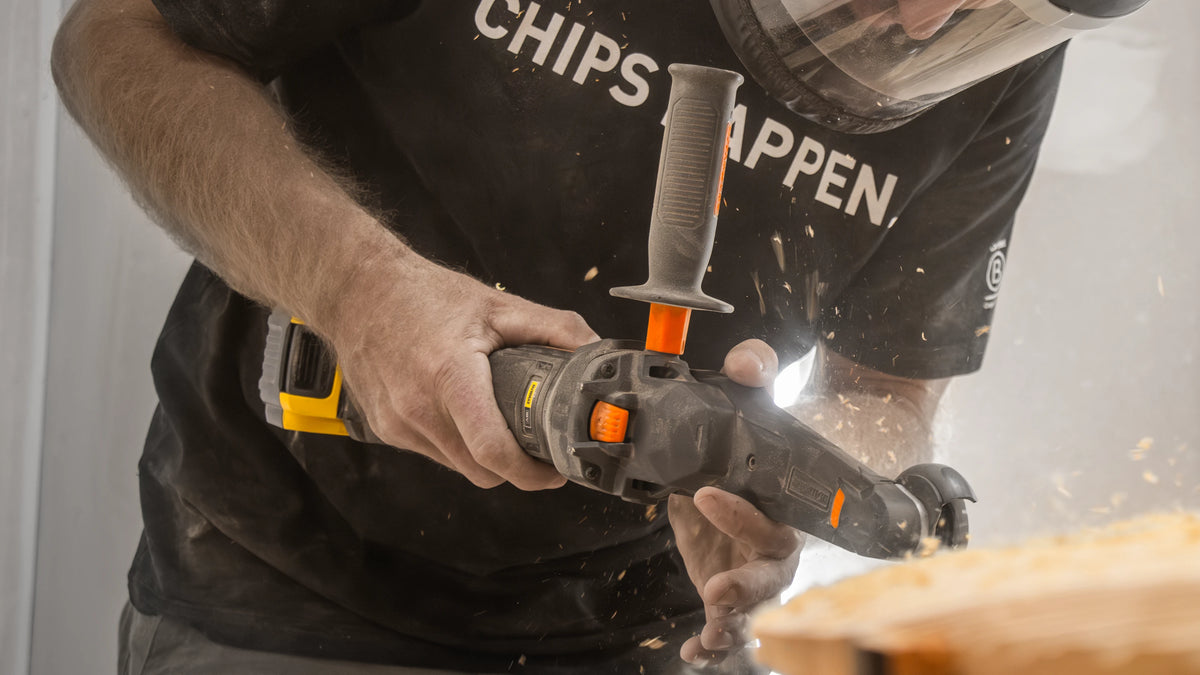 Man Power Carving & Sculpting Wood with Arbortech Mini Carver. Wood Chips Flying