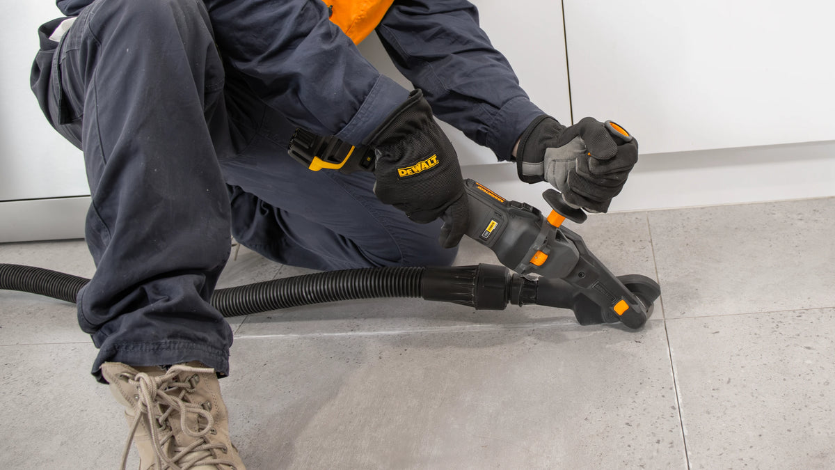 Arbortech Mini Grinder Removing Grout From Grey Tiles