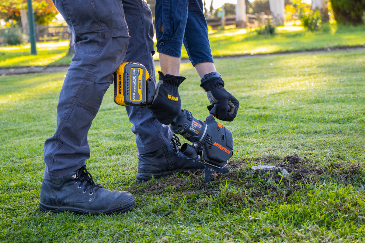 Cutting a precise circle around a lawn sprinkler with the Arbortech ALLSAW turf blade